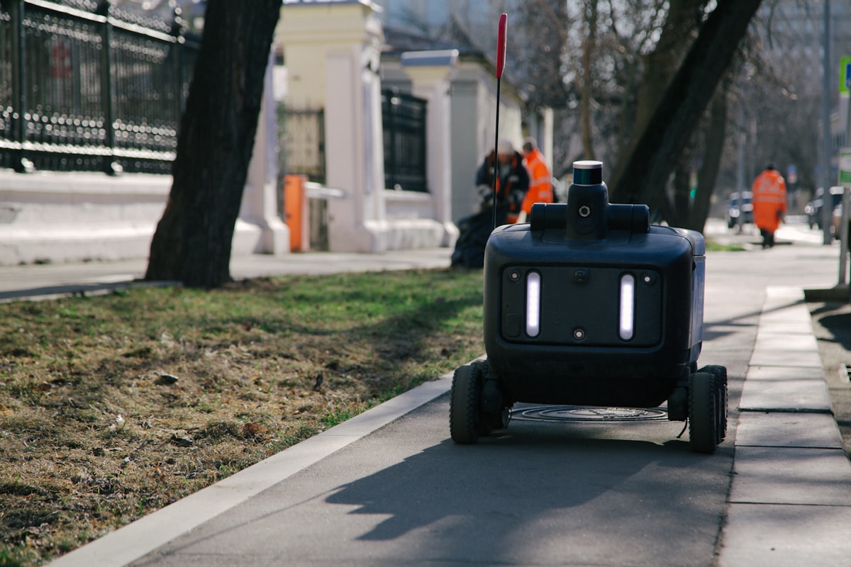 A delivery robot on a pavement
